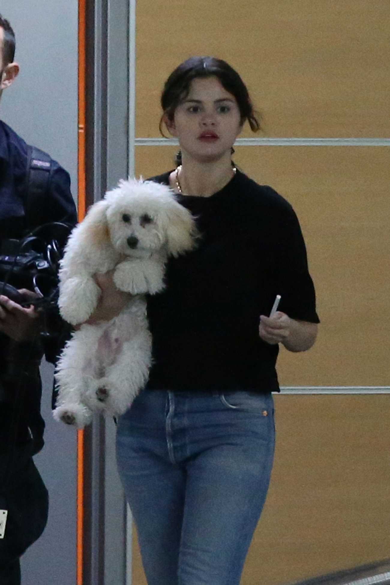 Selena_Gomez_-_leaving_a__Shark_Tank__filming_studio_with_her_puppy_in_West_Hollywood_September_232C_2019-01.jpg