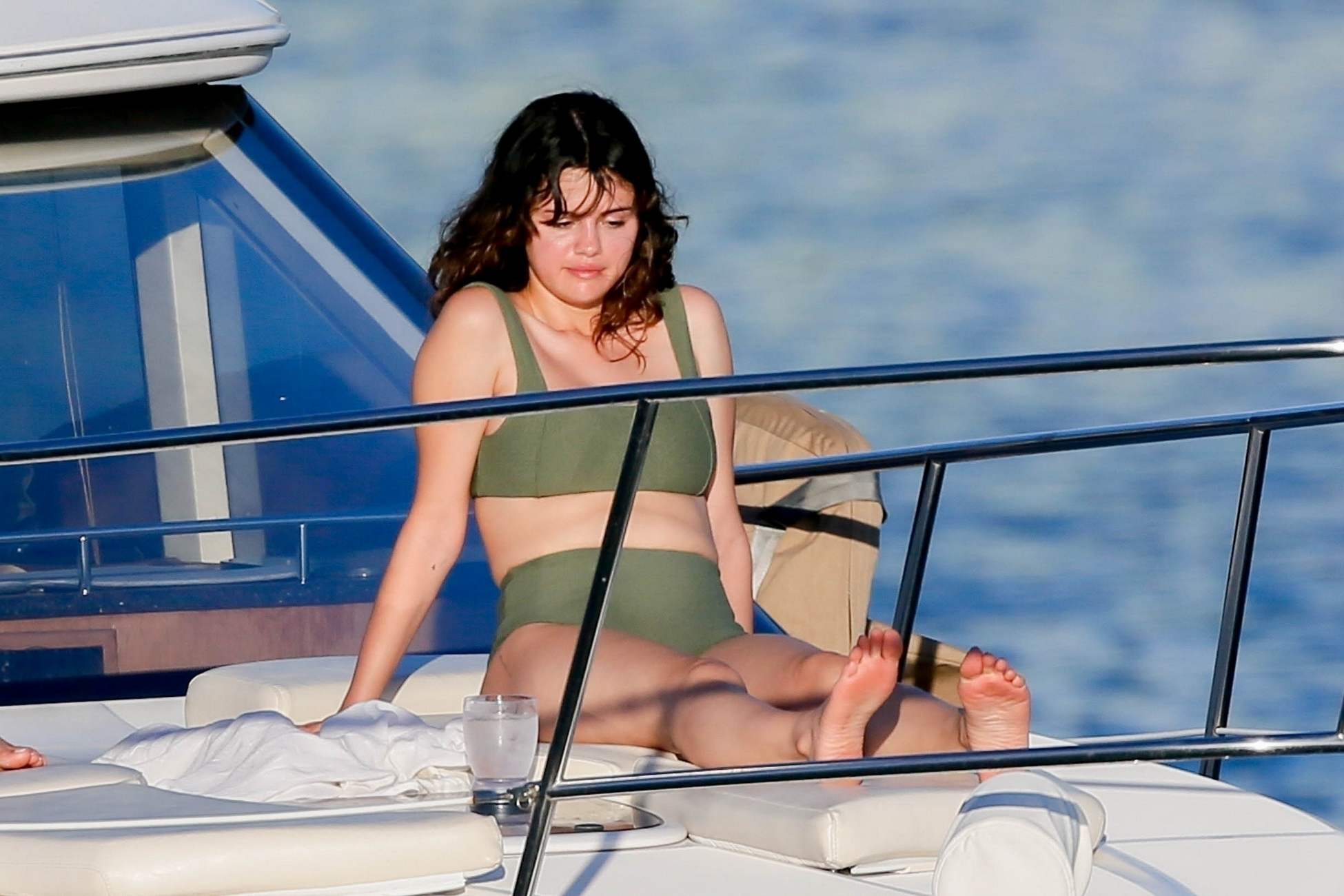 Selena_Gomez-stuns_as_she_soaks_up_the_sun_in_a_green_bikini_in_Hawaii2C_HI...